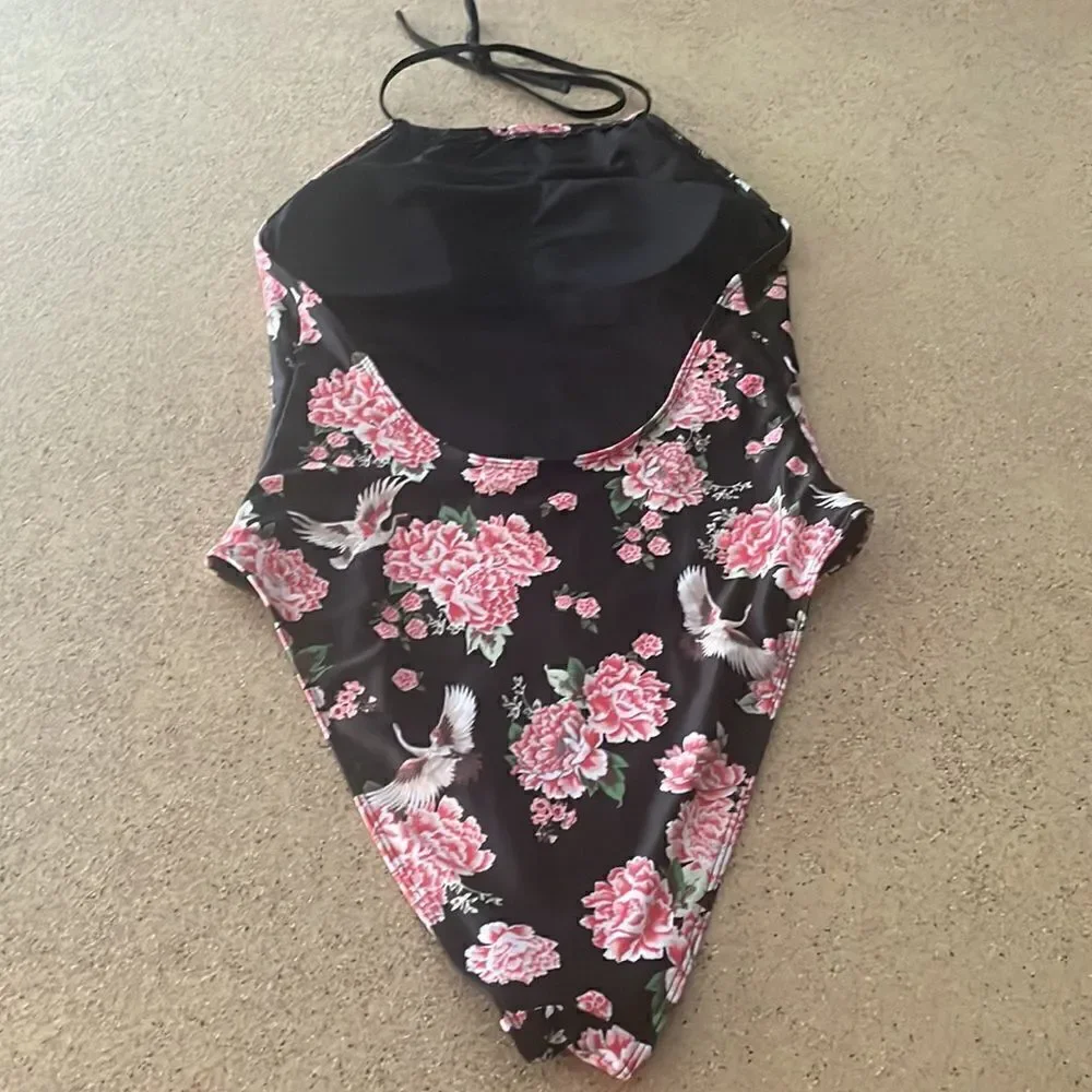 Black halter neck one piece swimsuit with roses and cranes print